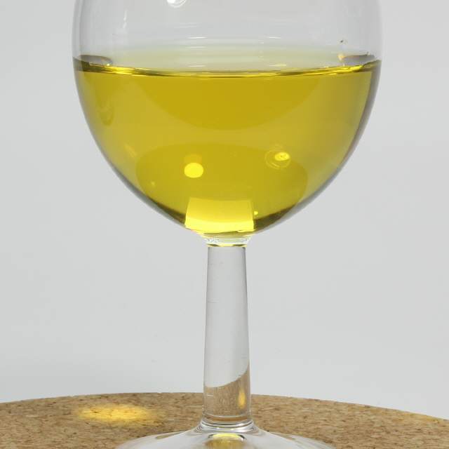 Yellow Golden Colloidal Silver 25ppm in a wine glas